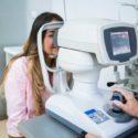 Optometrists performing eye exams on patients in a clinic