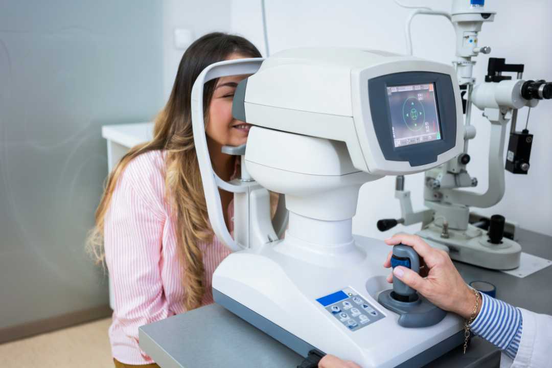 Optometrists performing eye exams on patients in a clinic